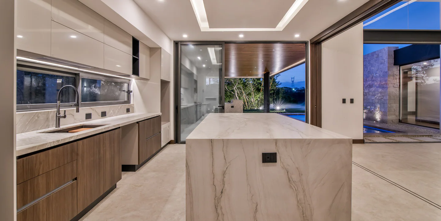 Contemporary kitchen opening to the terrace at Valle del Sol 400
