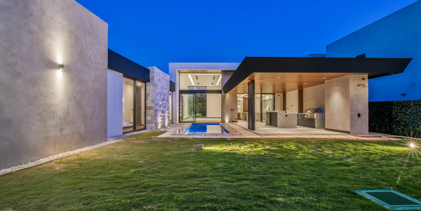 Valle del Sol 400 courtyard and social pavilion illuminated at dusk